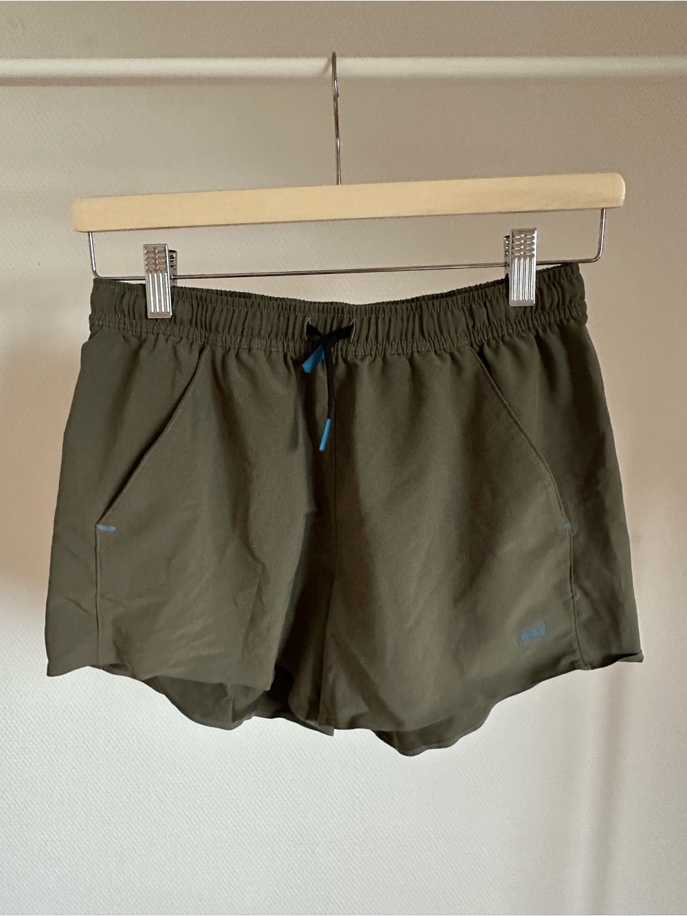 Janji Olive Green Running Shorts with Blue Accents